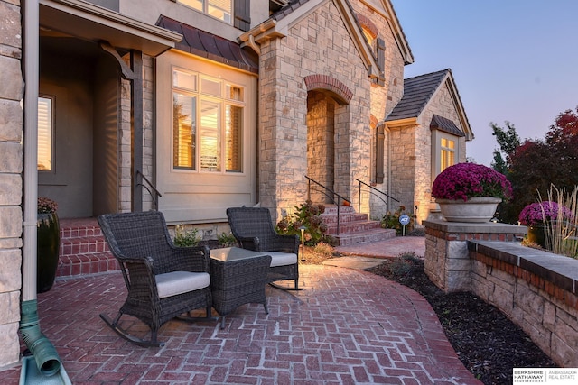 view of patio terrace at dusk