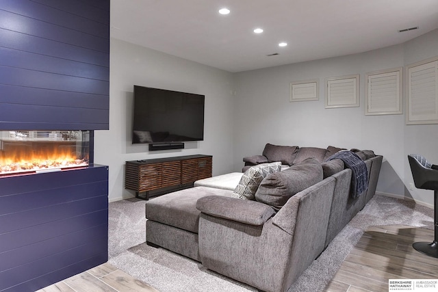 living room with light hardwood / wood-style floors