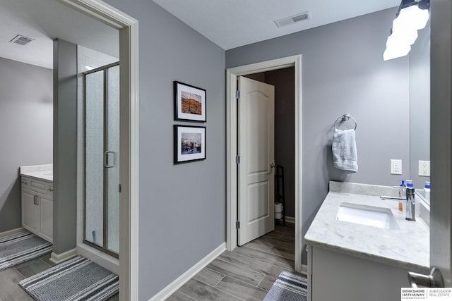 bathroom with vanity and walk in shower