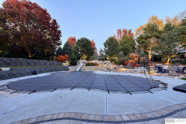 view of pool featuring a patio area