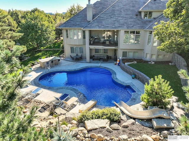 view of swimming pool featuring a patio