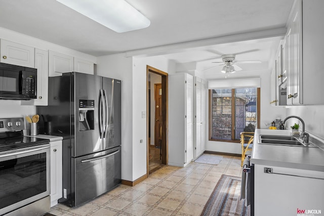 kitchen featuring white cabinetry, sink, stainless steel appliances, and ceiling fan