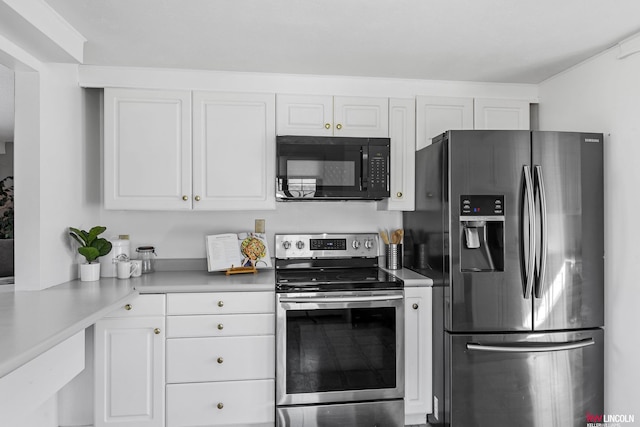 kitchen featuring appliances with stainless steel finishes and white cabinets