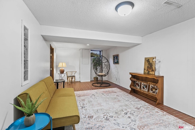 living room featuring a textured ceiling