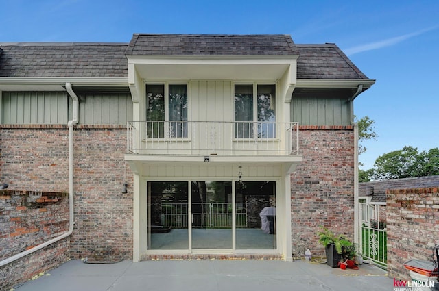 rear view of house with a balcony