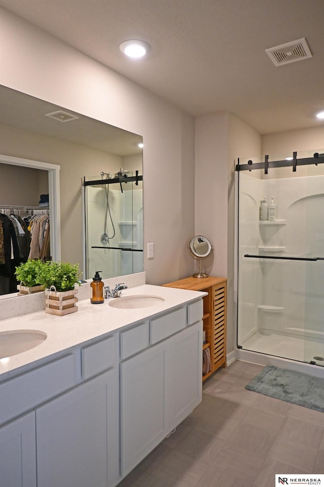 bathroom with vanity and walk in shower