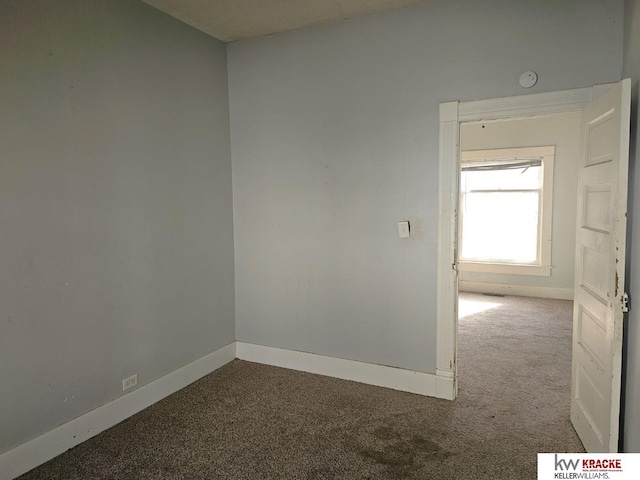 unfurnished room featuring carpet flooring