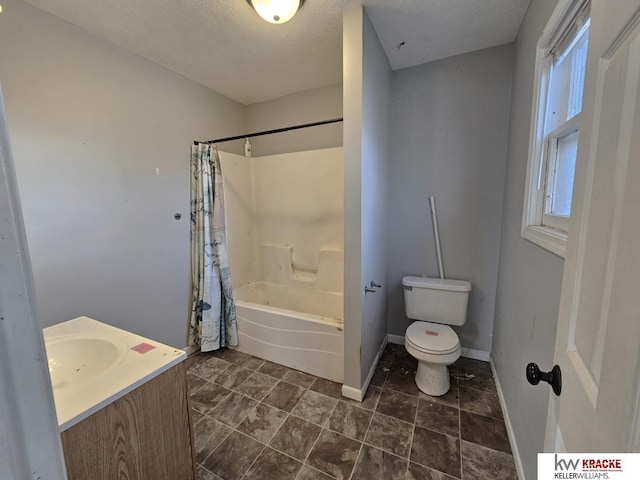 full bathroom featuring vanity, a textured ceiling, toilet, and shower / bath combo