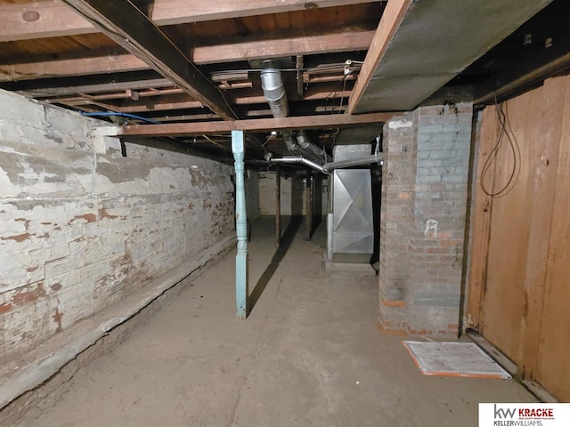 basement featuring heating unit