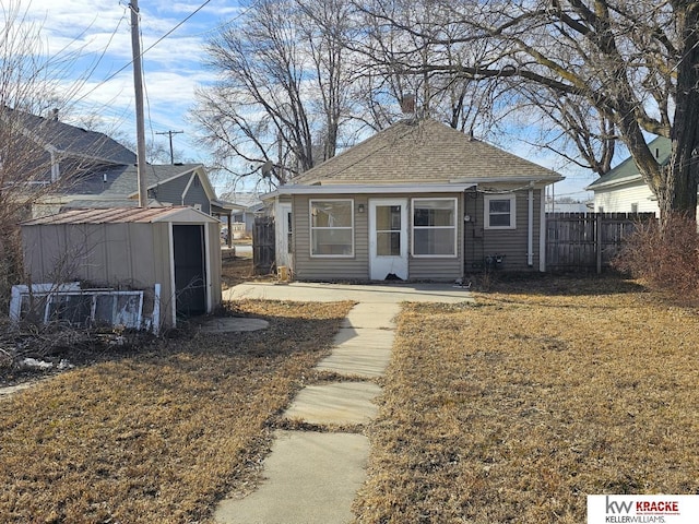 view of front of home featuring a shed