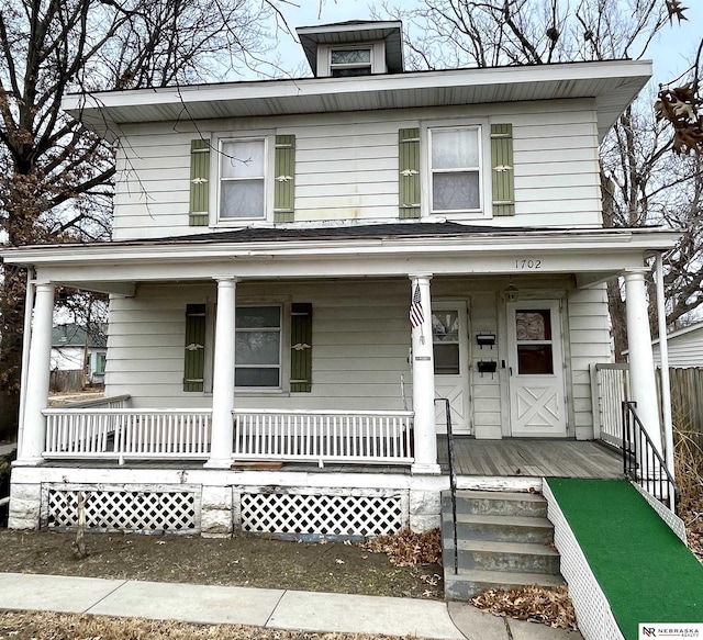 traditional style home featuring a porch