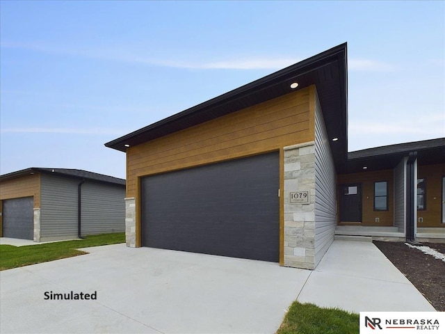 exterior space with a garage and an outdoor structure