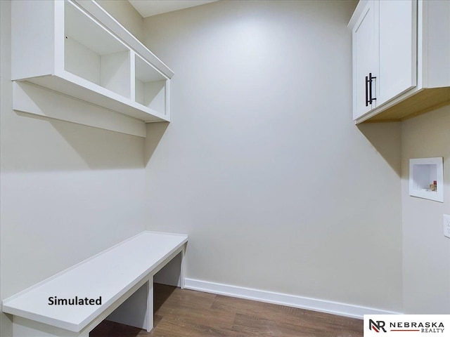 mudroom with dark wood-type flooring and baseboards