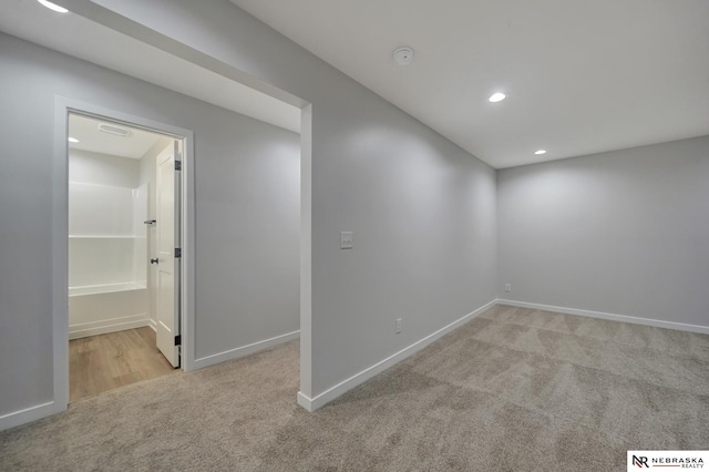 below grade area featuring carpet, baseboards, and recessed lighting