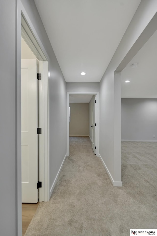 hall featuring carpet, baseboards, and recessed lighting