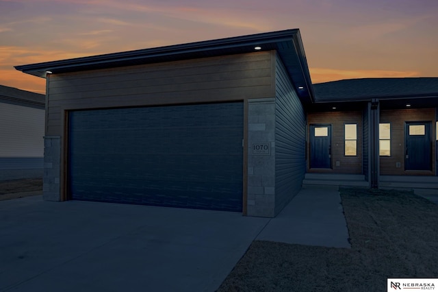 modern home featuring driveway and an attached garage