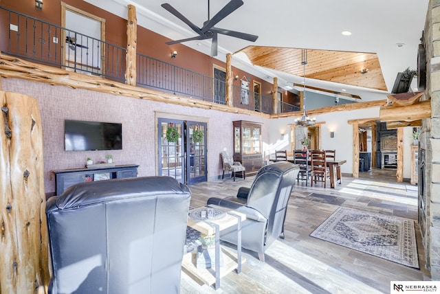 living room featuring high vaulted ceiling, light hardwood / wood-style floors, ceiling fan, wooden ceiling, and french doors