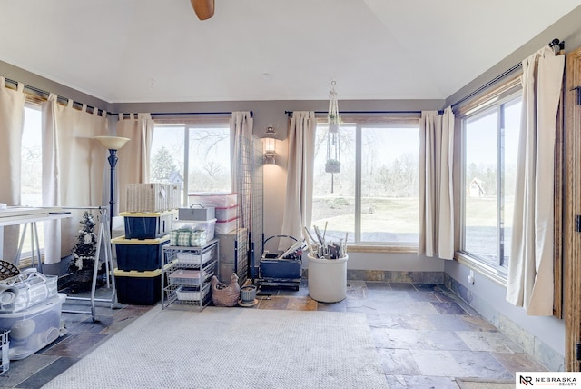 sunroom / solarium with lofted ceiling and a wealth of natural light