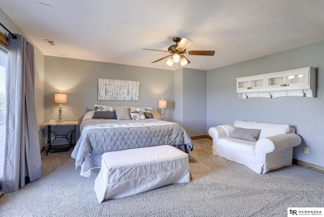 bedroom with light carpet and ceiling fan