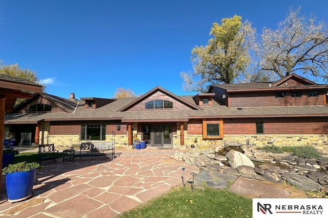 rear view of house featuring a patio