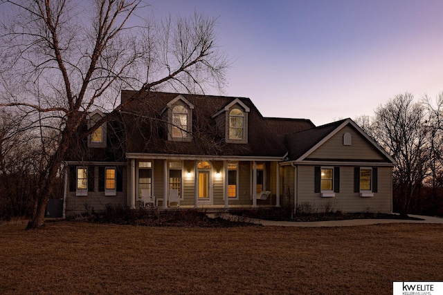 cape cod home with covered porch