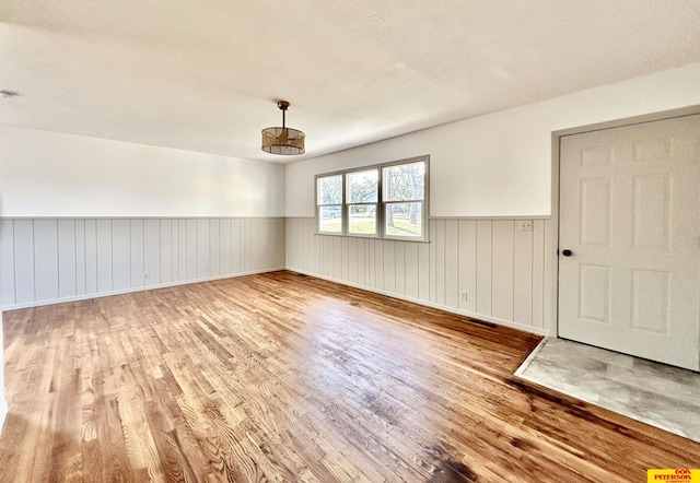 empty room with wood-type flooring