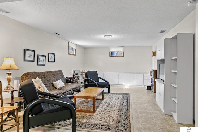 living room with a textured ceiling