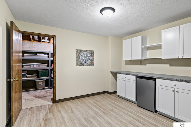 kitchen with white cabinetry, dishwasher, and light wood-type flooring