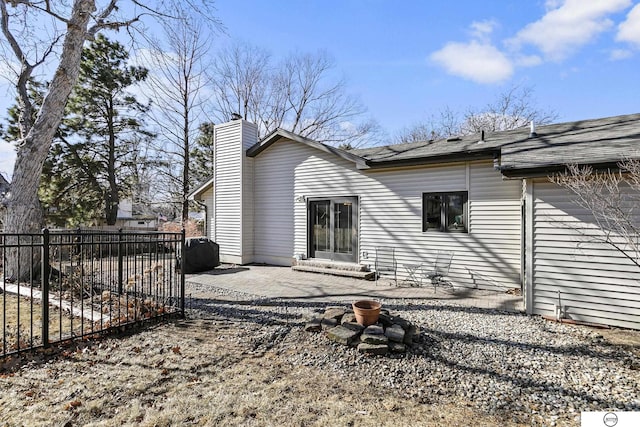 rear view of property featuring a patio