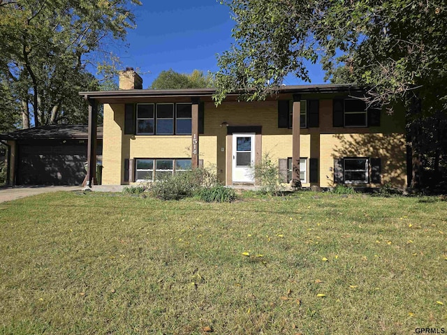 split foyer home with a front lawn