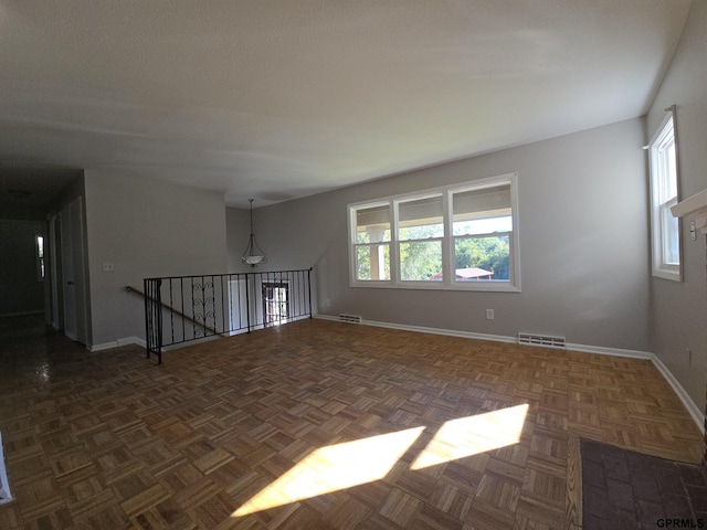 empty room featuring dark parquet floors