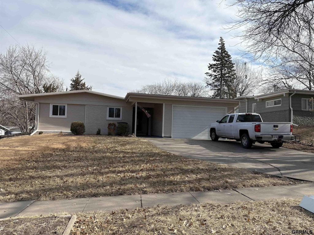 ranch-style home with a garage