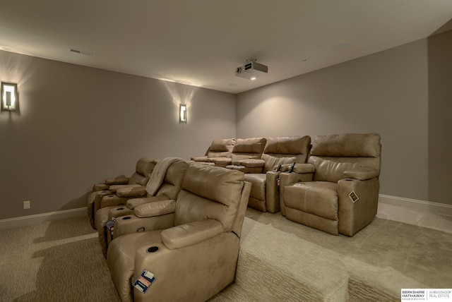 home theater room featuring light carpet, visible vents, and baseboards