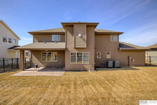 back of property with a yard, fence, central AC, and a patio area