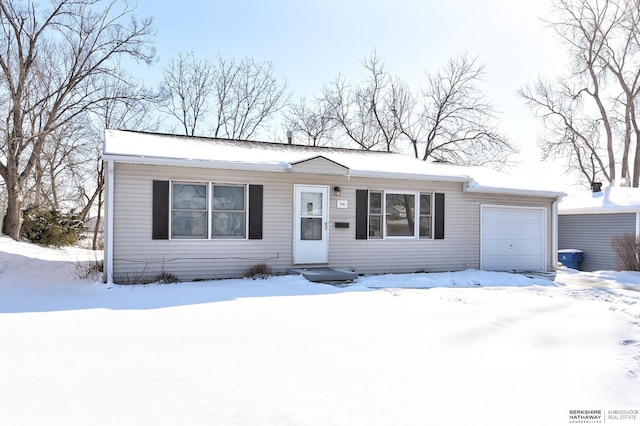 single story home featuring a garage