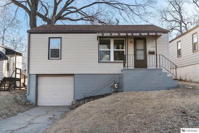 view of front of property with a garage