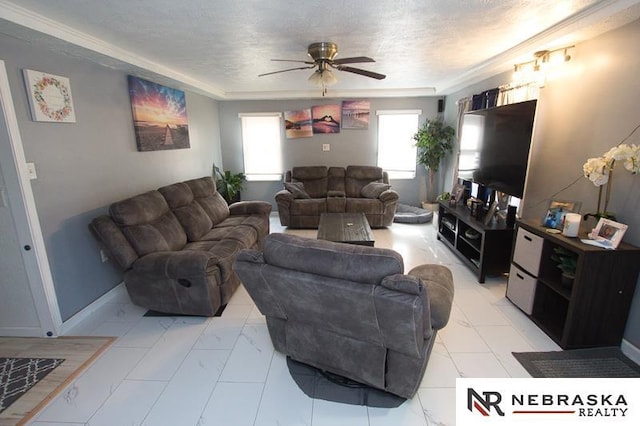 living room featuring ceiling fan and a textured ceiling