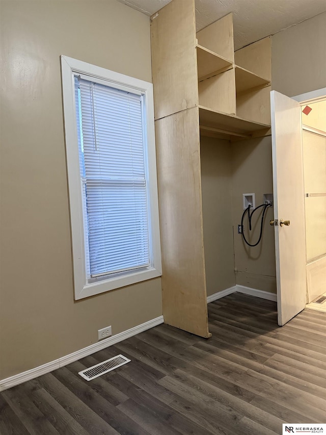 washroom with washer hookup and dark hardwood / wood-style floors