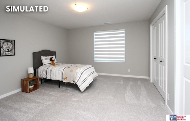 bedroom with a closet and carpet