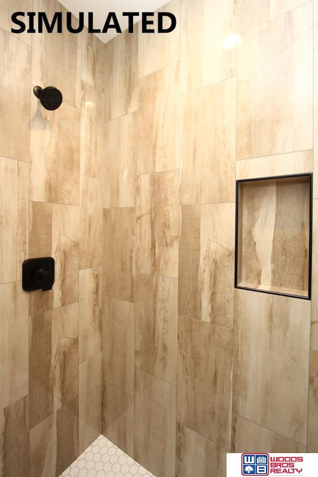 bathroom with a tile shower