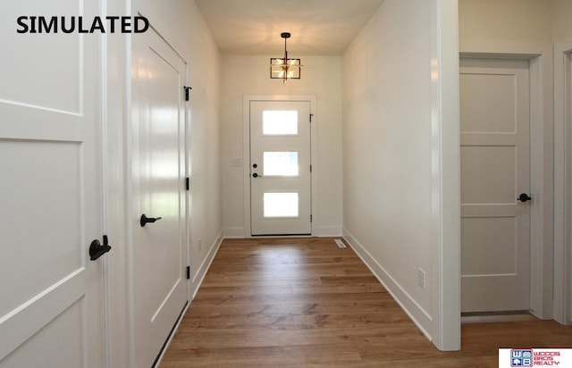 doorway featuring hardwood / wood-style flooring