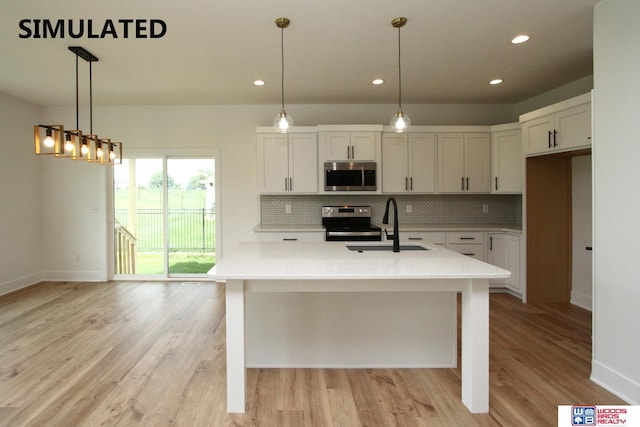 kitchen featuring sink, appliances with stainless steel finishes, white cabinetry, backsplash, and decorative light fixtures