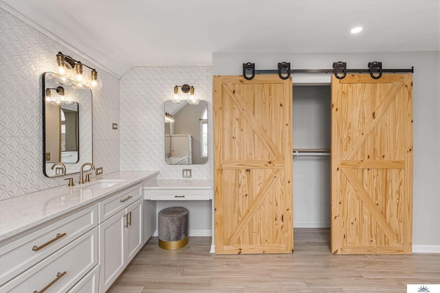 bathroom featuring vanity and hardwood / wood-style floors