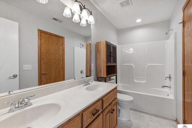 full bathroom with toilet, tile patterned floors, vanity, and bathtub / shower combination