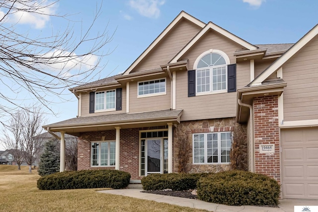 view of front of house featuring a garage and a front yard