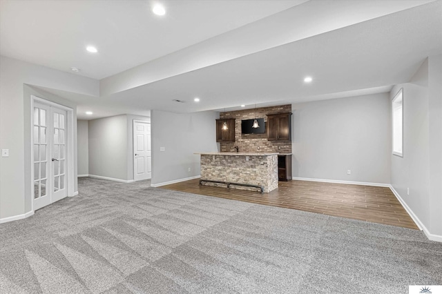 unfurnished living room featuring carpet