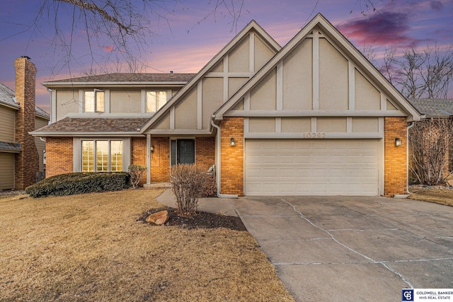 english style home with a garage