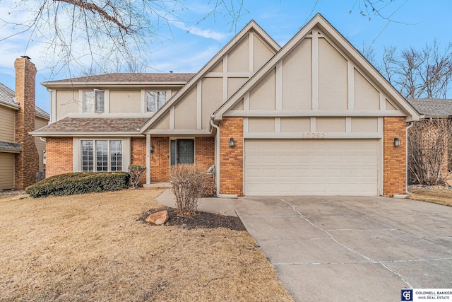 tudor house featuring a garage