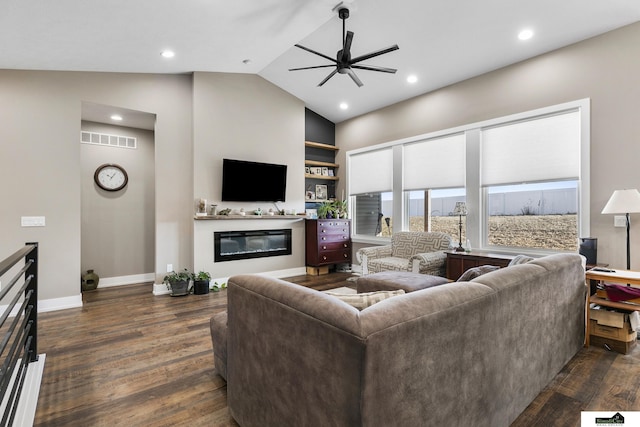 living room with lofted ceiling, dark hardwood / wood-style floors, and ceiling fan