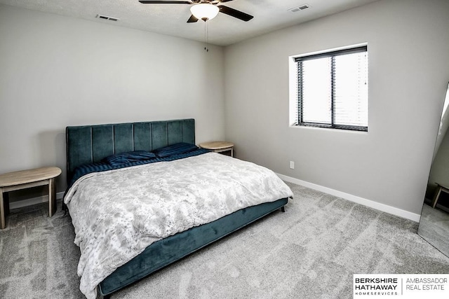 bedroom featuring a textured ceiling, ceiling fan, and carpet flooring